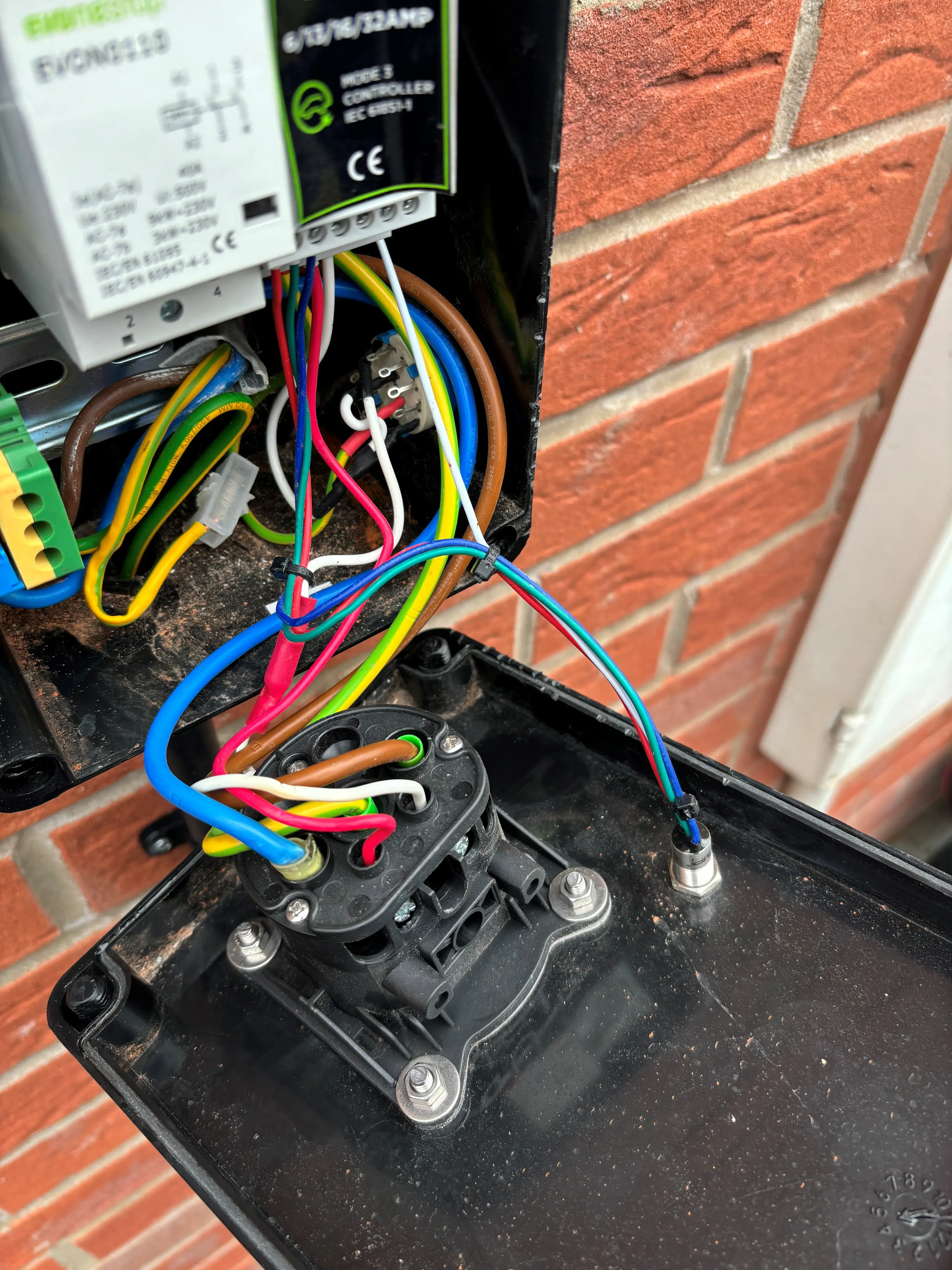 wires are connected to a black box with a red, yellow, and blue wire