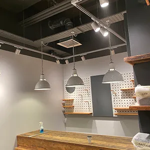a room that has some lights hanging from the ceiling