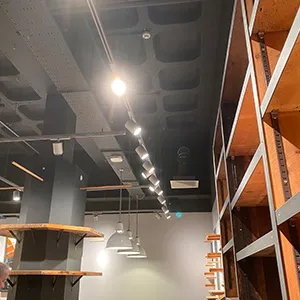 a large room with a lot of shelves and lights