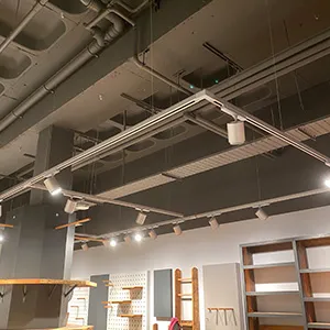 a room with a lot of shelves and lights