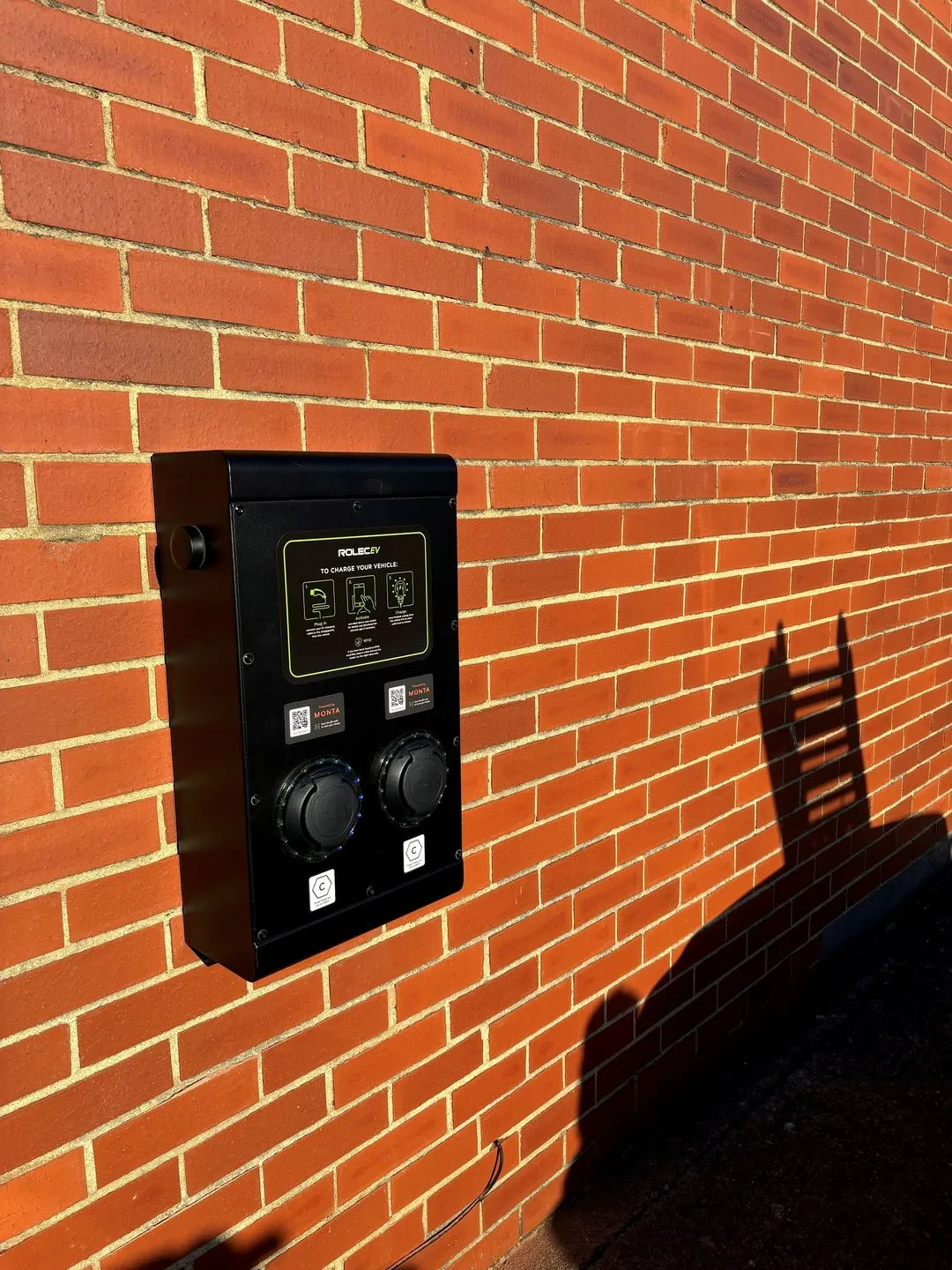 A brick wall with a clock on it.