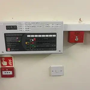 A control panel mounted on the wall of a room.