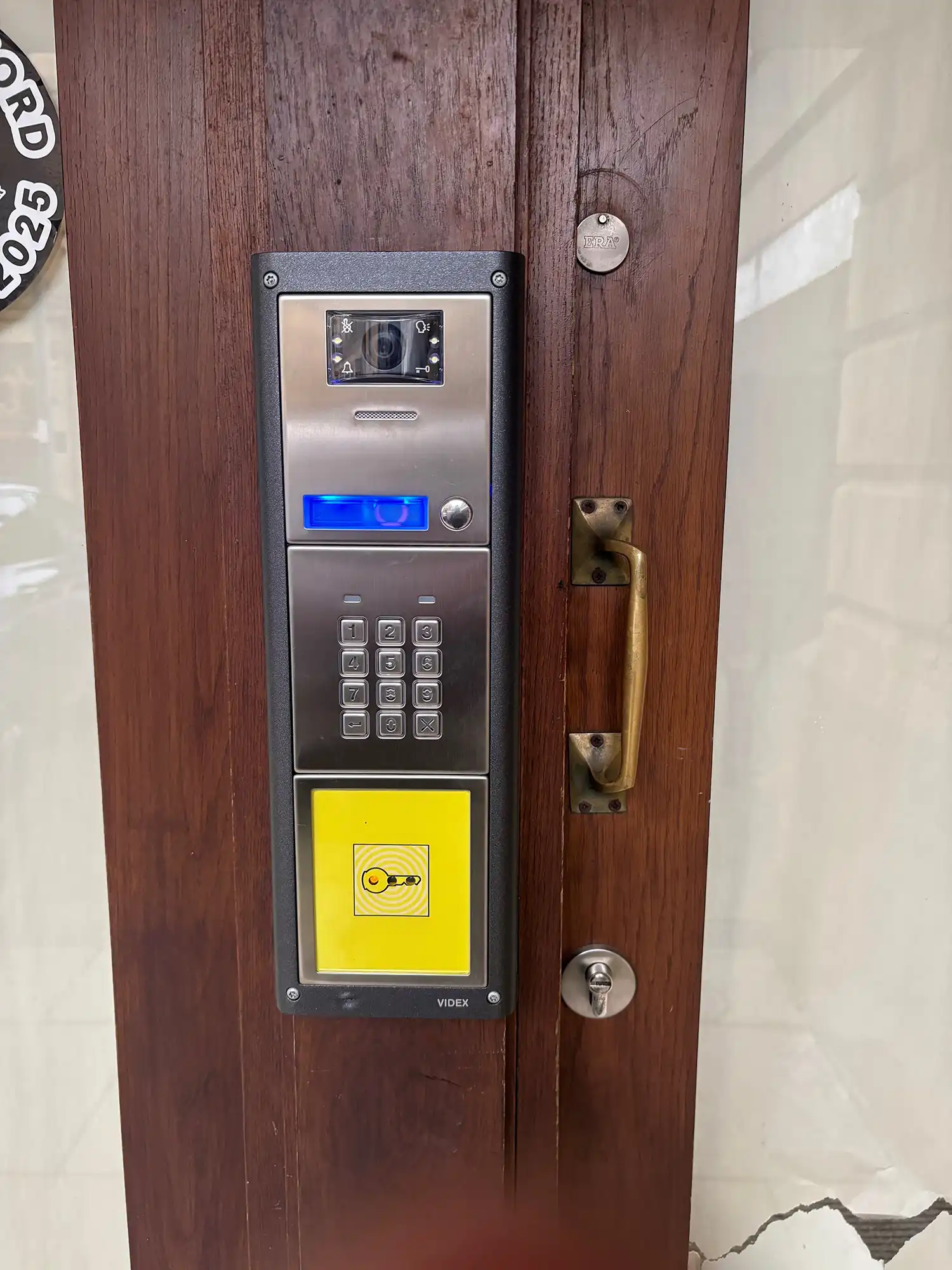 A close up of a door with a keypad.