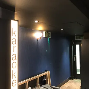 a room with a blue wall and a white light