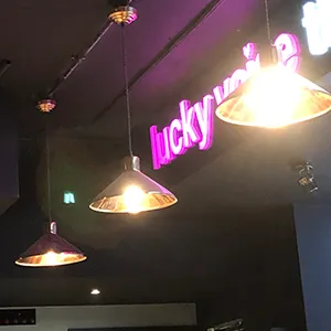 a group of lights hanging from the ceiling of a restaurant