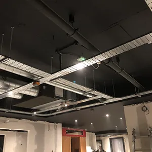 a room that has some lights on the ceiling